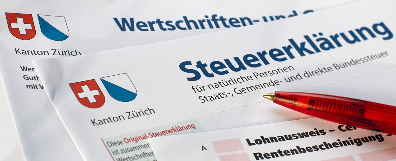 Close-up of swiss tax form with red pencil